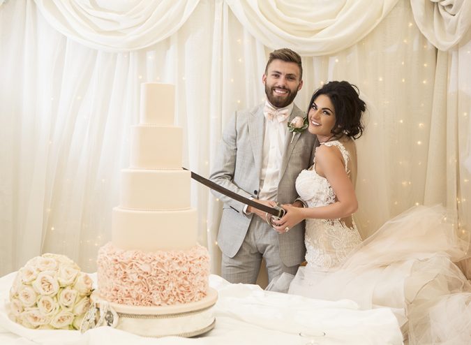Cutting wedding cake at Castle Leslie
