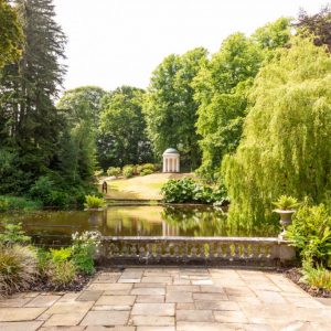 Lady Alice's Temple, looking west.This domed temple was given as a wedding gift to Lady Alice Hill by her brother, the 5th Marquess of Downshire in 1867. A circular seat inside the temple sits behind a screen of Ionic columns.